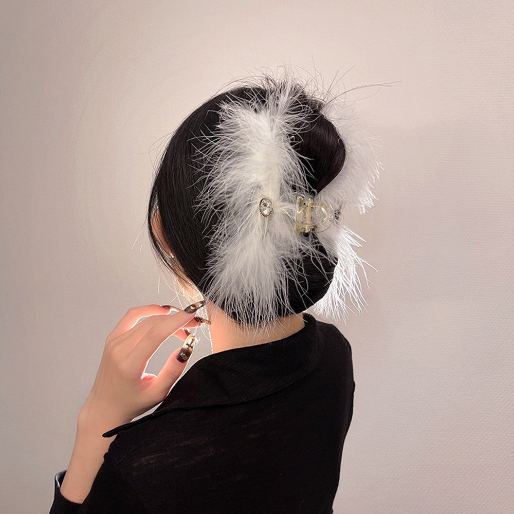 Feather Grabbing Ostrich Feathers On The Back Of The Head