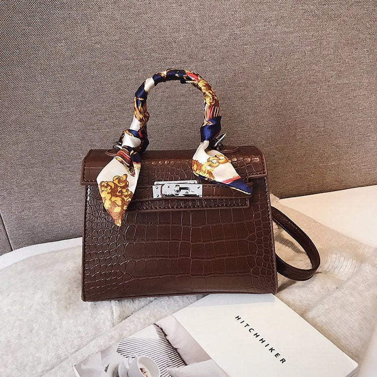 A Cross-Body Bag with a Stone Design