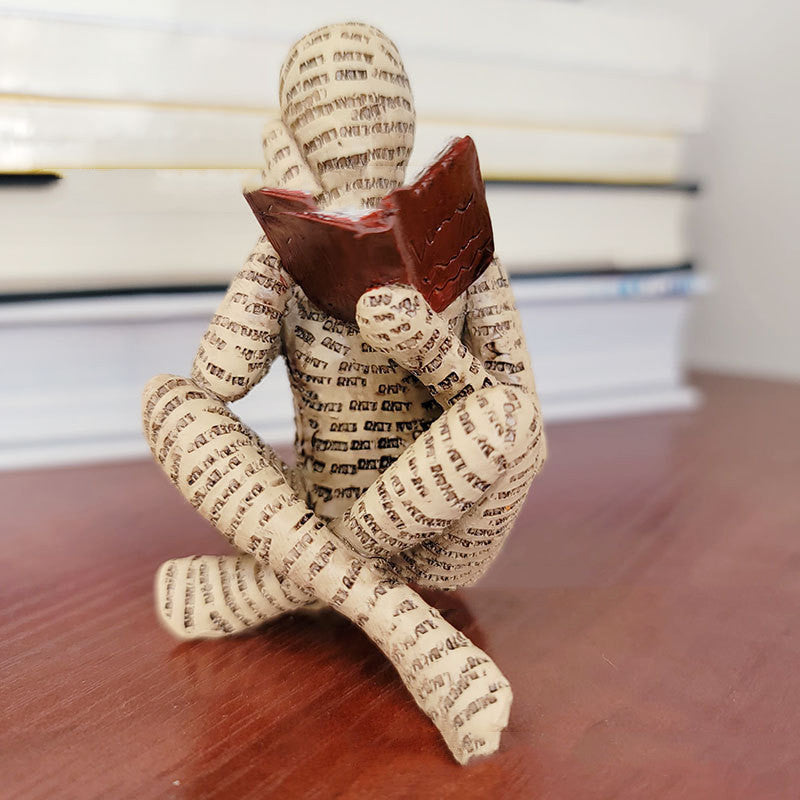 A Woman Reading A Paper Pulp Molding Ornament Tree