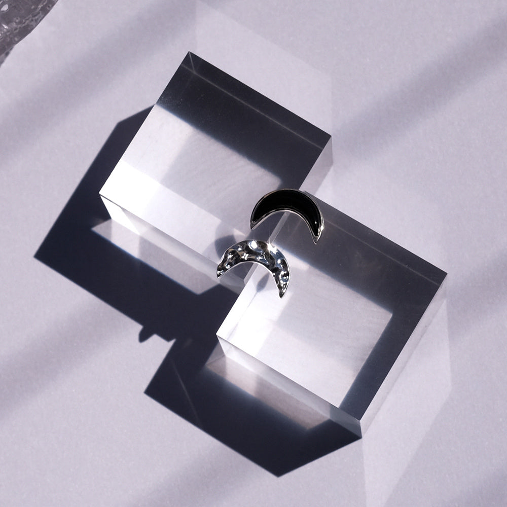 A Pair Of Asymmetrical Moon Earrings